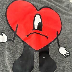 Bad Bunny T-shirt with logo on front.  Fun easy throw on t-shirt. Form fitting.